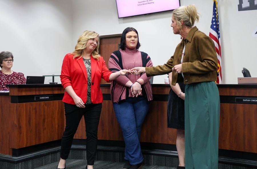Cassy Barnes Receiving Coin from School Board President Sarah Owen